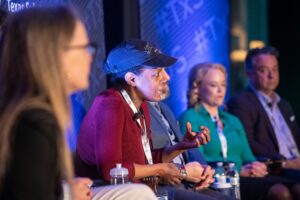 Speaker elaborating during past symposia event