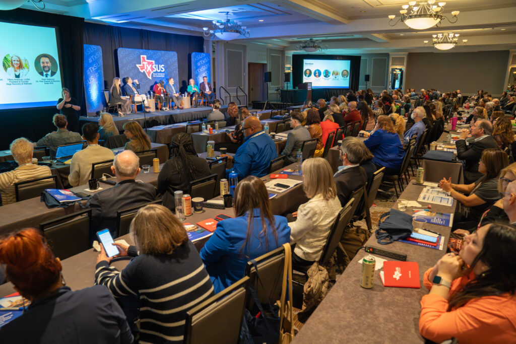 TxSUS 2024 audience listening to a panel session
